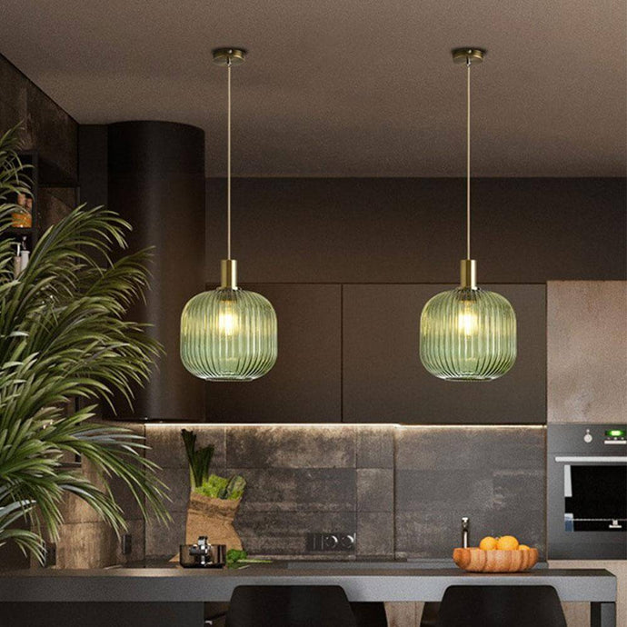 Two Nordic Coloured Glass Pendant Lights in green above kitchen island