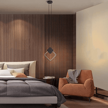 Load image into Gallery viewer, Black LED Full Crown Square Pendant Light above bedside table next to armchair
