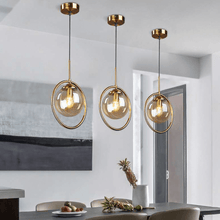 Load image into Gallery viewer, Three Modern Glass Ball Pendant Lights above dining table
