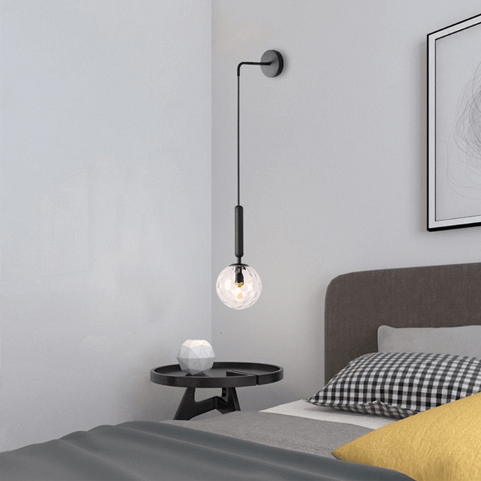 Black Nordic Globe Wall Light above coffee table in bedroom