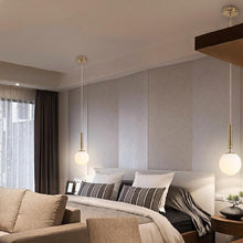 Load image into Gallery viewer, Gold Glass Ball Pendant Lamps above bedside tables either side of bed
