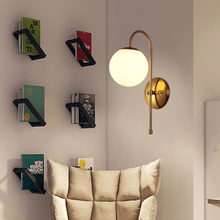 Load image into Gallery viewer, Modern Globe Wall Lamp on wall above armchair in living room
