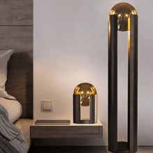 Load image into Gallery viewer, Amber Nordic Metal Floor Lamp and Amber Nordic Metal Table Lamp next to bed in bedroom
