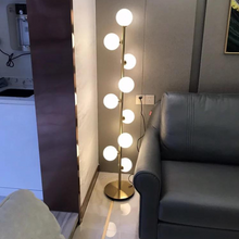 Load image into Gallery viewer, Modern Glass Ball Floor Lamp next to sofa in living room
