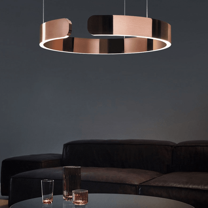 Rose Gold Creative Designer Ring Light above coffee table in living room
