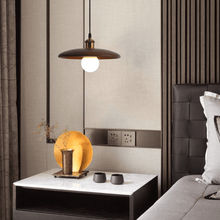 Load image into Gallery viewer, Oriental Wood Disc Light above bedside table in bedroom
