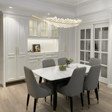 Load image into Gallery viewer, Gold Modern Leaf-Shaped Chandelier above kitchen table
