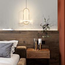 Load image into Gallery viewer, Gold Scandinavian LED Pendant Light above wooden bedside table in bedroom
