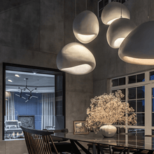 Load image into Gallery viewer, Five Japanese Style Pebble Pendant Lights above dark dining room table
