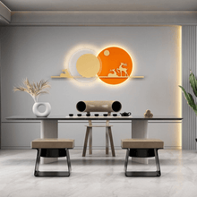 Load image into Gallery viewer, Orange Reindeer Wall Light on wall behind dining room table
