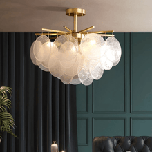 Load image into Gallery viewer, Modern Artistic Gold Chandelier above sofa in living room
