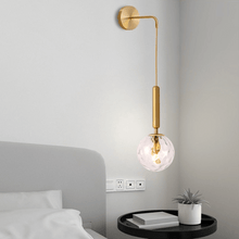 Load image into Gallery viewer, Gold Nordic Globe Wall Light above coffee table in bedroom
