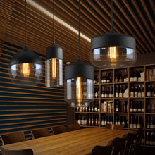 Load image into Gallery viewer, Black Modern Glass Pendant Lamps above table next to wine rack
