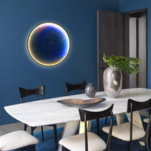 Load image into Gallery viewer, Neptune Planet Wall Light on wall behind dining table in dining room
