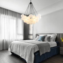 Load image into Gallery viewer, Black Frosted Glass Ball Chandelier above bed in bedroom
