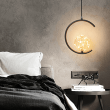 Load image into Gallery viewer, Black Globe String Pendant Light model A above bedside table in bedroom
