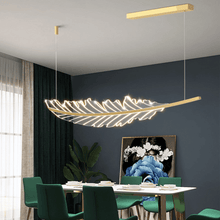 Load image into Gallery viewer, Gold Modern Leaf-Shaped Chandelier above dining room table with green chairs
