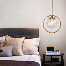 Load image into Gallery viewer, Modern Glass Ball Pendant Light above bedroom table
