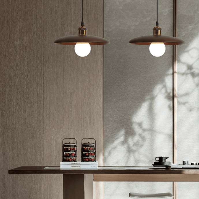Two Oriental Wood Disc Lights above living room table
