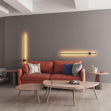 Load and play video in Gallery viewer, Nordic LED Pole Lights on living room wall behind orange sofa
