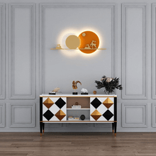 Load image into Gallery viewer, Orange Reindeer Wall Light above living room cabinet
