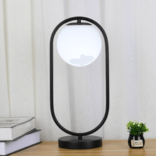 Load image into Gallery viewer, A black Modern Golden Globe Table Lamp on a table
