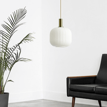 Load image into Gallery viewer, White Nordic Coloured Glass Pendant Light hanging in living room next to sofa and plant
