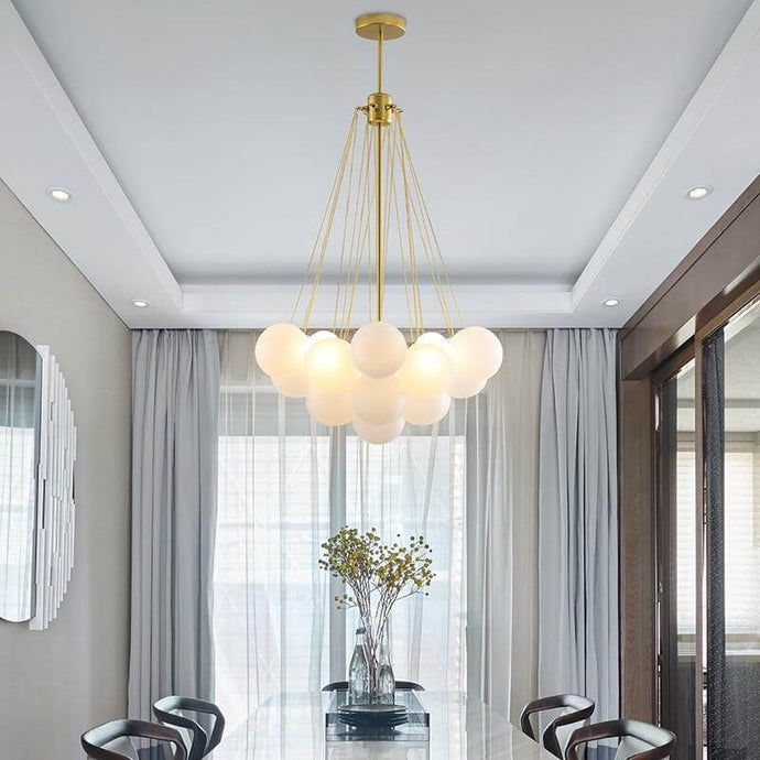 Gold Frosted Glass Ball Chandelier above dining table
