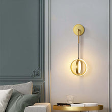 Load image into Gallery viewer, Gold Modern Luxury Ring Wall Light on bedroom wall above bedside table
