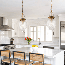 Load image into Gallery viewer, Two brass Kitchen Island Pendant Lights hanging above kitchen island
