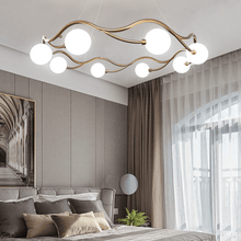 Load image into Gallery viewer, Circular Wave Chandelier above double bed in bedroom
