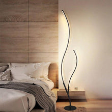 Load image into Gallery viewer, Modern Tree Branch Floor Lamp in front of bedside table next to bed in bedroom
