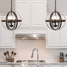 Load image into Gallery viewer, Two Rustic Globe Chandeliers above kitchen island
