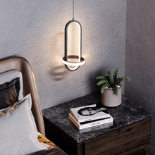 Load image into Gallery viewer, Black Scandinavian LED Pendant Light above bedside table in bedroom
