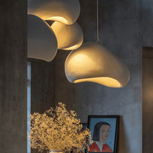Load image into Gallery viewer, Four Japanese Style Pebble Pendant Lights hanging above plant in lounge
