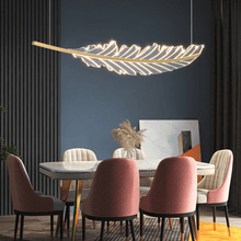 Load image into Gallery viewer, Gold Modern Leaf-Shaped Chandelier above dining table
