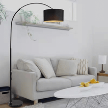Load image into Gallery viewer, Black Modern Essential Floor Lamp leaning over living room sofa
