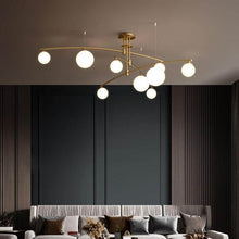 Load image into Gallery viewer, Gold Modern Long Arm Chandelier in living room
