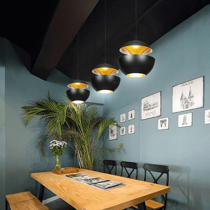 Black Modern Globe Pendant Lights above dining room table