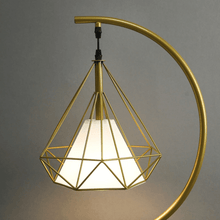 Load image into Gallery viewer, Close-up of Gold Nordic Triangle Tripod Floor Lamp
