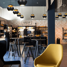 Load image into Gallery viewer, Black Modern Globe Pendant Lights above cafe shelves
