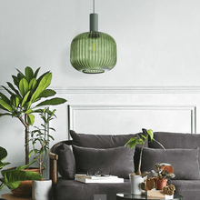 Load image into Gallery viewer, Green Nordic Coloured Glass Pendant Light above sofa in living room
