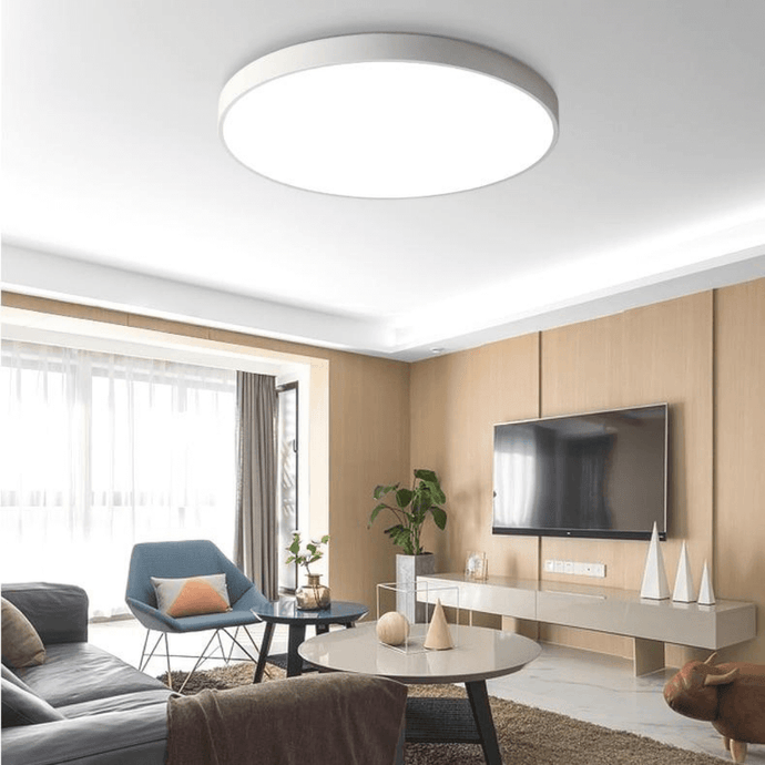 White Ultra-Thin LED Ceiling Light on living room ceiling above sofa and coffee table