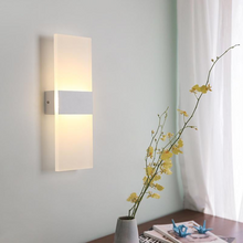 Load image into Gallery viewer, White Modern LED Wall Lamp on wall above cabinet
