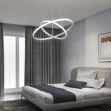 Load image into Gallery viewer, White LED Ring Chandelier above bed in bedroom
