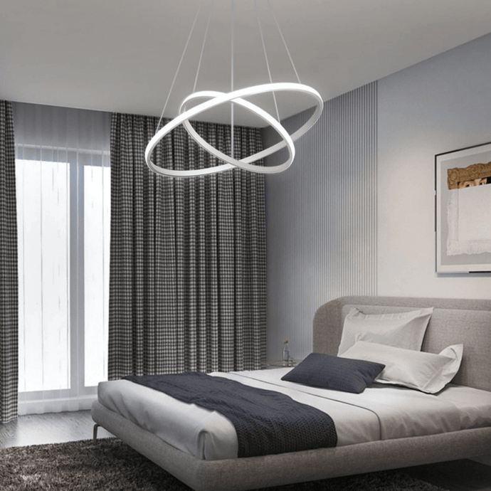 White LED Ring Chandelier above bed in bedroom