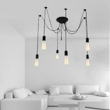 Load image into Gallery viewer, Cavelights Spider Chandelier above corner sofa in living room
