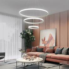 Load image into Gallery viewer, White LED Ring Chandelier above coffee table in living room

