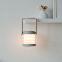 Load image into Gallery viewer, Cavelights Portable Night Light hanging off wall shelf
