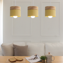 Load image into Gallery viewer, Yellow Nordic Wooden Hanging Ceiling Lamps above living room table and sofa
